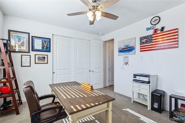 office with carpet, baseboards, and ceiling fan