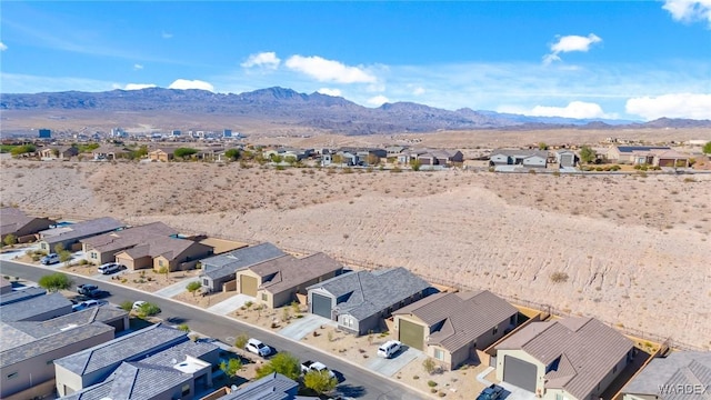 drone / aerial view featuring a residential view and a mountain view