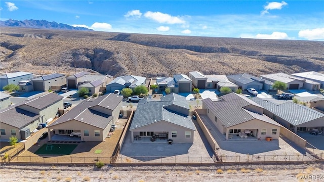 birds eye view of property with a residential view and a mountain view