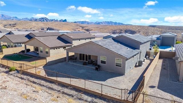 drone / aerial view featuring a residential view and a mountain view