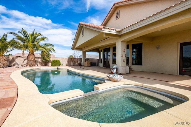 view of pool featuring an in ground hot tub, a patio area, a fenced backyard, and a fenced in pool