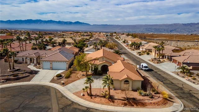 bird's eye view featuring a residential view and a mountain view