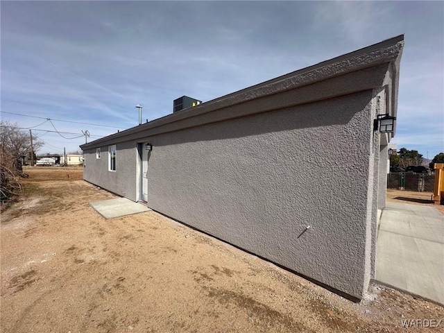 view of property exterior with stucco siding