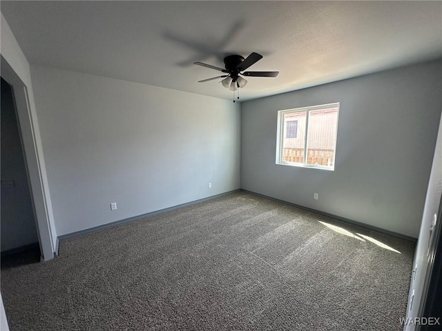 unfurnished bedroom featuring carpet flooring, a ceiling fan, and baseboards