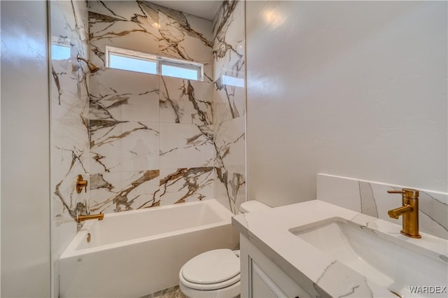 bathroom with toilet, bathing tub / shower combination, and vanity