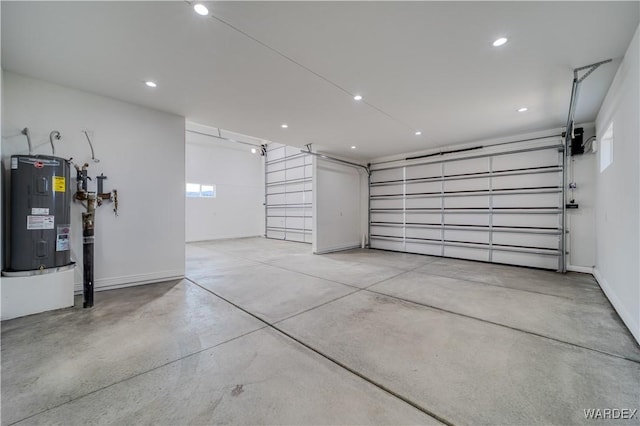 garage with recessed lighting, water heater, and baseboards