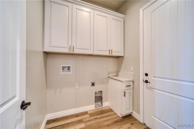 laundry area featuring washer hookup, cabinet space, light wood-style flooring, electric dryer hookup, and baseboards