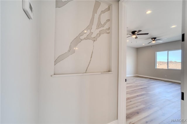 interior space featuring light wood finished floors, recessed lighting, and baseboards