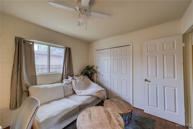 living area featuring ceiling fan and wood finished floors