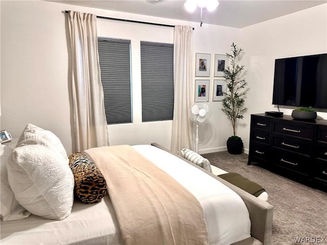 carpeted bedroom with baseboards