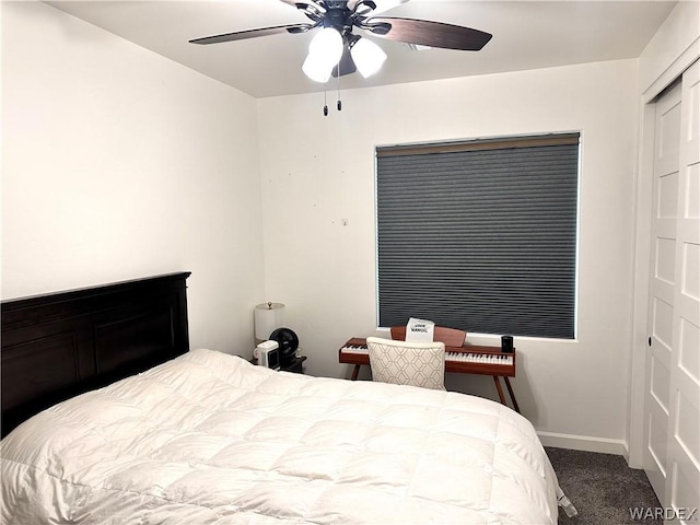 bedroom with carpet floors, ceiling fan, baseboards, and a closet