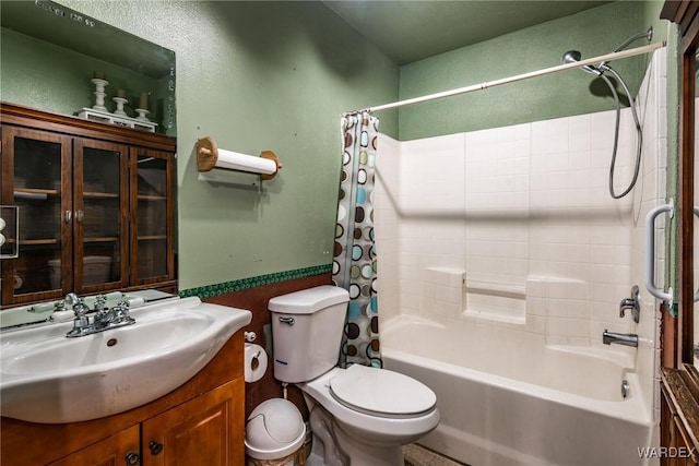 bathroom featuring vanity, shower / bath combination with curtain, and toilet