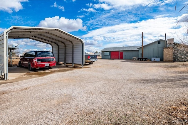 view of parking / parking lot featuring a detached carport