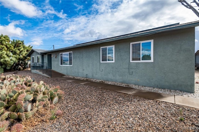 view of property exterior with stucco siding