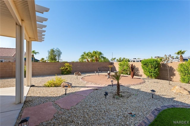 view of yard with a fenced backyard and a patio