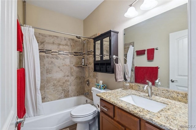 bathroom featuring shower / tub combo with curtain, vanity, and toilet