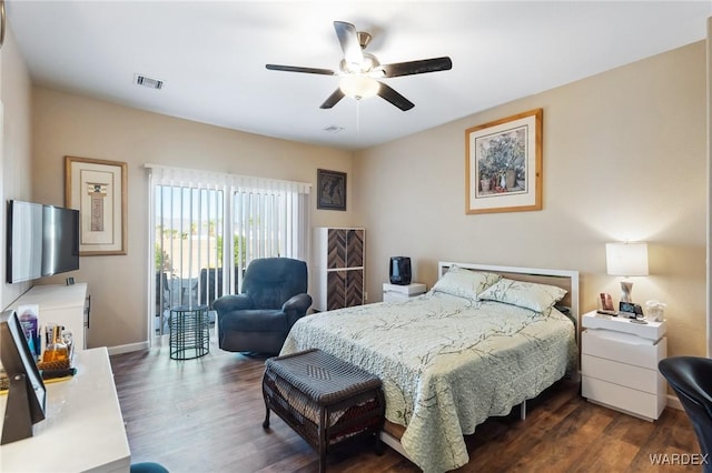 bedroom with access to exterior, dark wood finished floors, visible vents, a ceiling fan, and baseboards