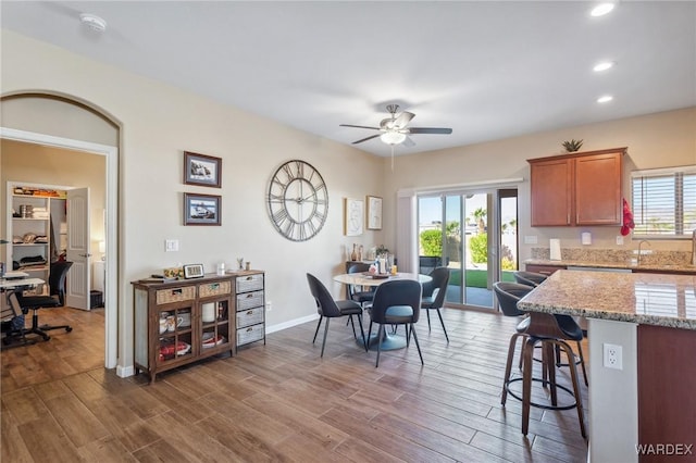 dining space featuring plenty of natural light, a ceiling fan, wood finished floors, and recessed lighting