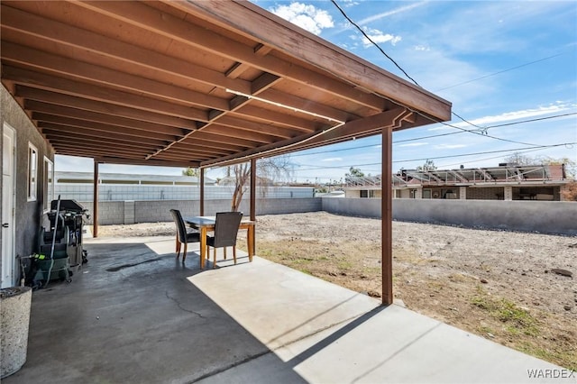 view of patio / terrace with a fenced backyard, outdoor dining area, and area for grilling