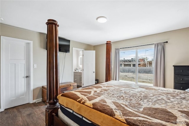 bedroom with ensuite bathroom and dark wood finished floors