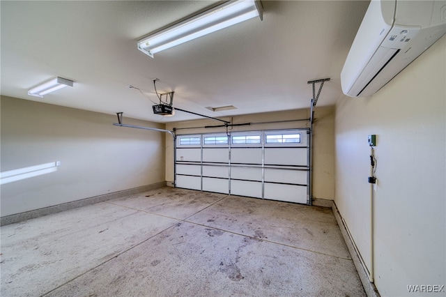 garage with a garage door opener, baseboards, and a wall mounted AC