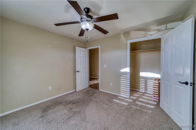 unfurnished bedroom with a closet, carpet flooring, a ceiling fan, and baseboards