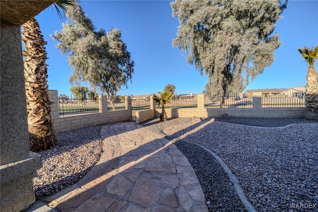 view of yard with a patio and fence