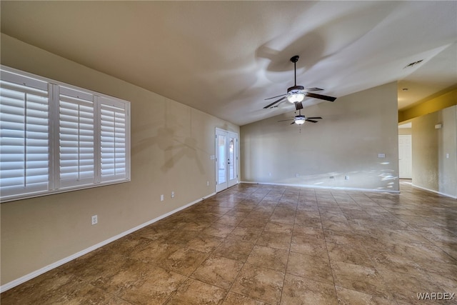 unfurnished room featuring lofted ceiling, baseboards, and a ceiling fan