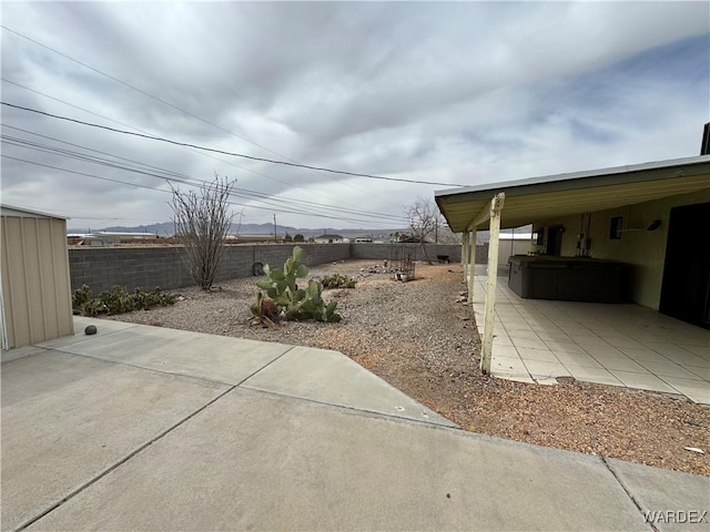 view of yard featuring a patio area and a fenced backyard