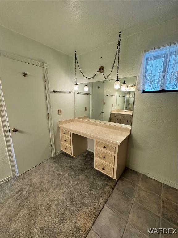 bathroom with a textured ceiling