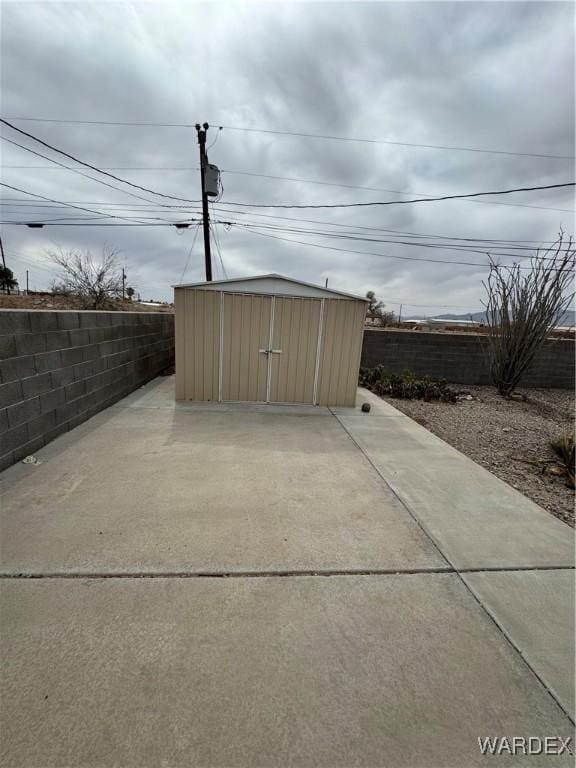 view of shed with a fenced backyard