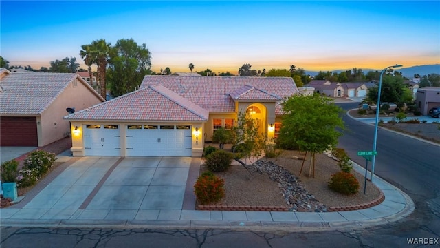 1878 E Clear Lake Dr, Fort Mohave, AZ 86426 - single story home featuring a garage, stucco siding, a tiled roof, and concrete driveway