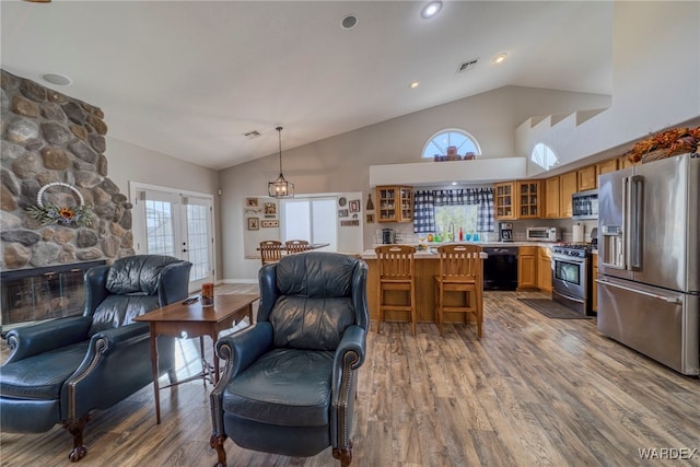 1878 E Clear Lake Dr, Fort Mohave, AZ 86426 - living room featuring a wealth of natural light, wood finished floors, and visible vents