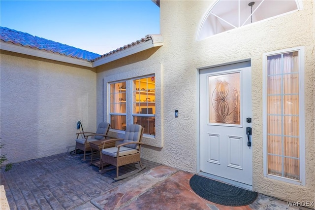 1878 E Clear Lake Dr, Fort Mohave, AZ 86426 - property entrance with a patio and stucco siding