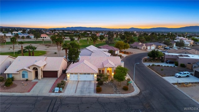 1878 E Clear Lake Dr, Fort Mohave, AZ 86426 - aerial view at dusk featuring a residential view and a mountain view