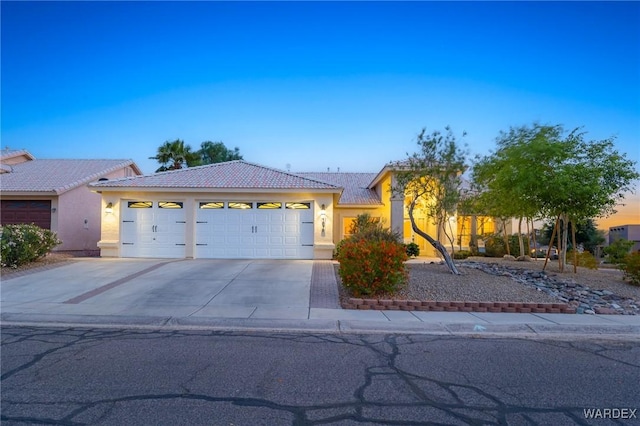 1878 E Clear Lake Dr, Fort Mohave, AZ 86426 - ranch-style home with a tiled roof, an attached garage, concrete driveway, and stucco siding