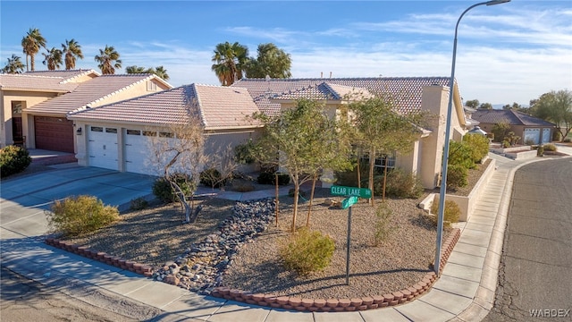 1878 E Clear Lake Dr, Fort Mohave, AZ 86426 - view of front of property featuring a garage, driveway, and stucco siding