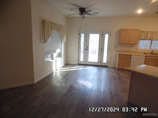 kitchen with dark wood-type flooring, light countertops, dishwasher, and light brown cabinetry