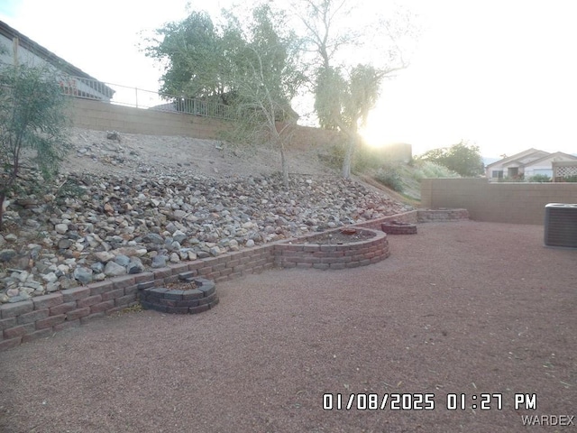 view of yard with a patio, a fenced backyard, and cooling unit