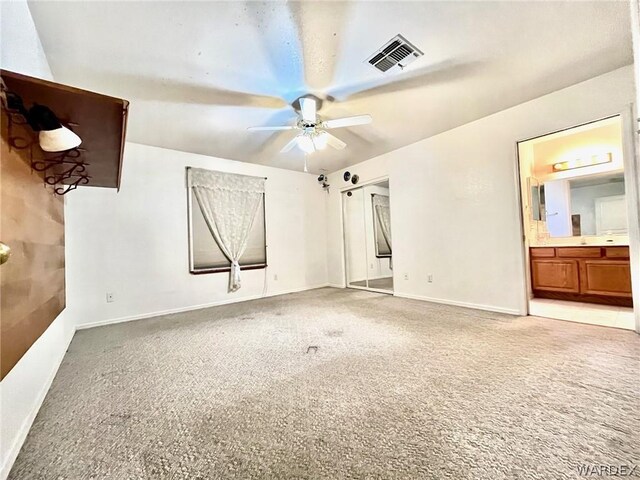 unfurnished bedroom with baseboards, visible vents, and light colored carpet