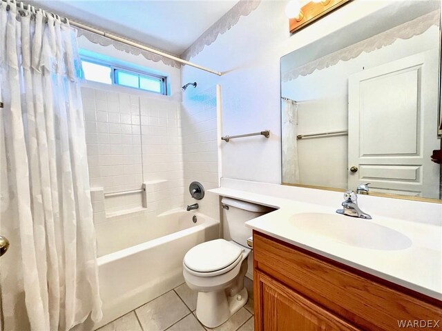 full bath featuring shower / bath combination with curtain, tile patterned flooring, vanity, and toilet