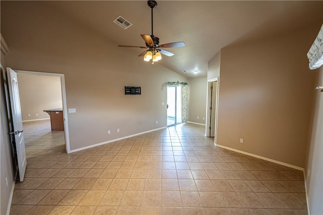 unfurnished room with light tile patterned flooring, ceiling fan, baseboards, and high vaulted ceiling