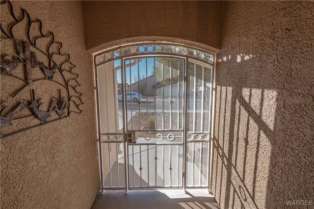 view of exterior entry featuring stucco siding