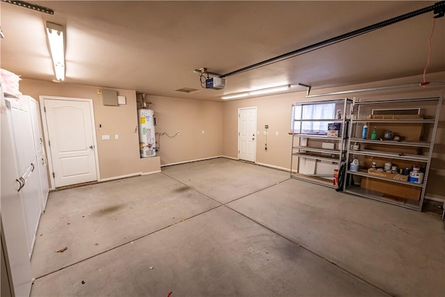 garage with gas water heater, a garage door opener, and baseboards
