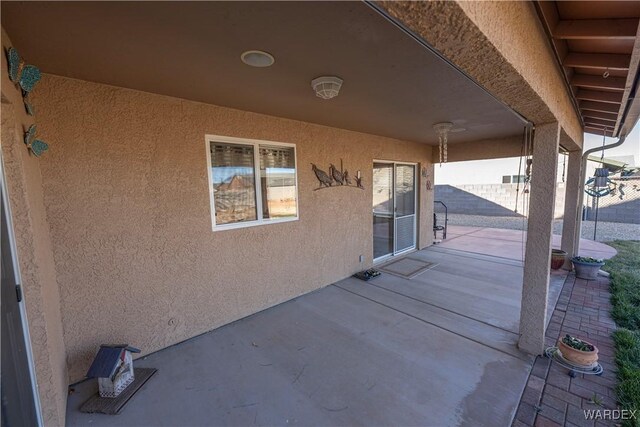 view of patio / terrace featuring fence