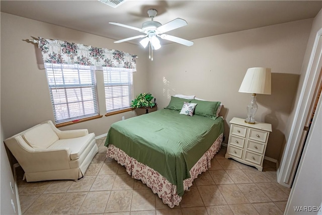 bedroom with light tile patterned floors, ceiling fan, and visible vents