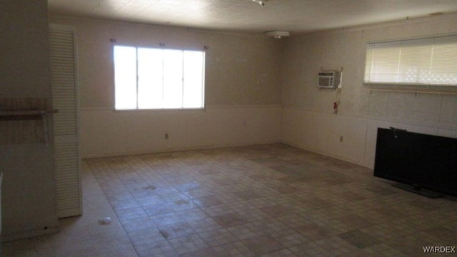 spare room with a wall mounted air conditioner