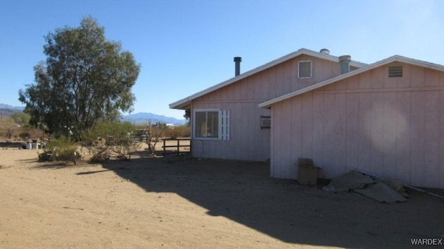 view of home's exterior with a mountain view