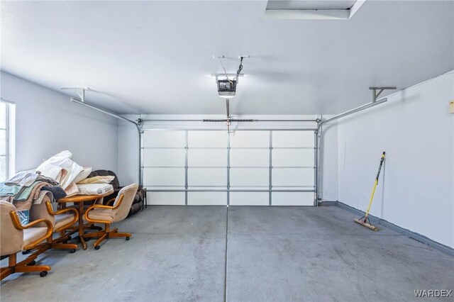 garage featuring a garage door opener