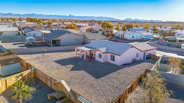 birds eye view of property featuring a mountain view and a residential view